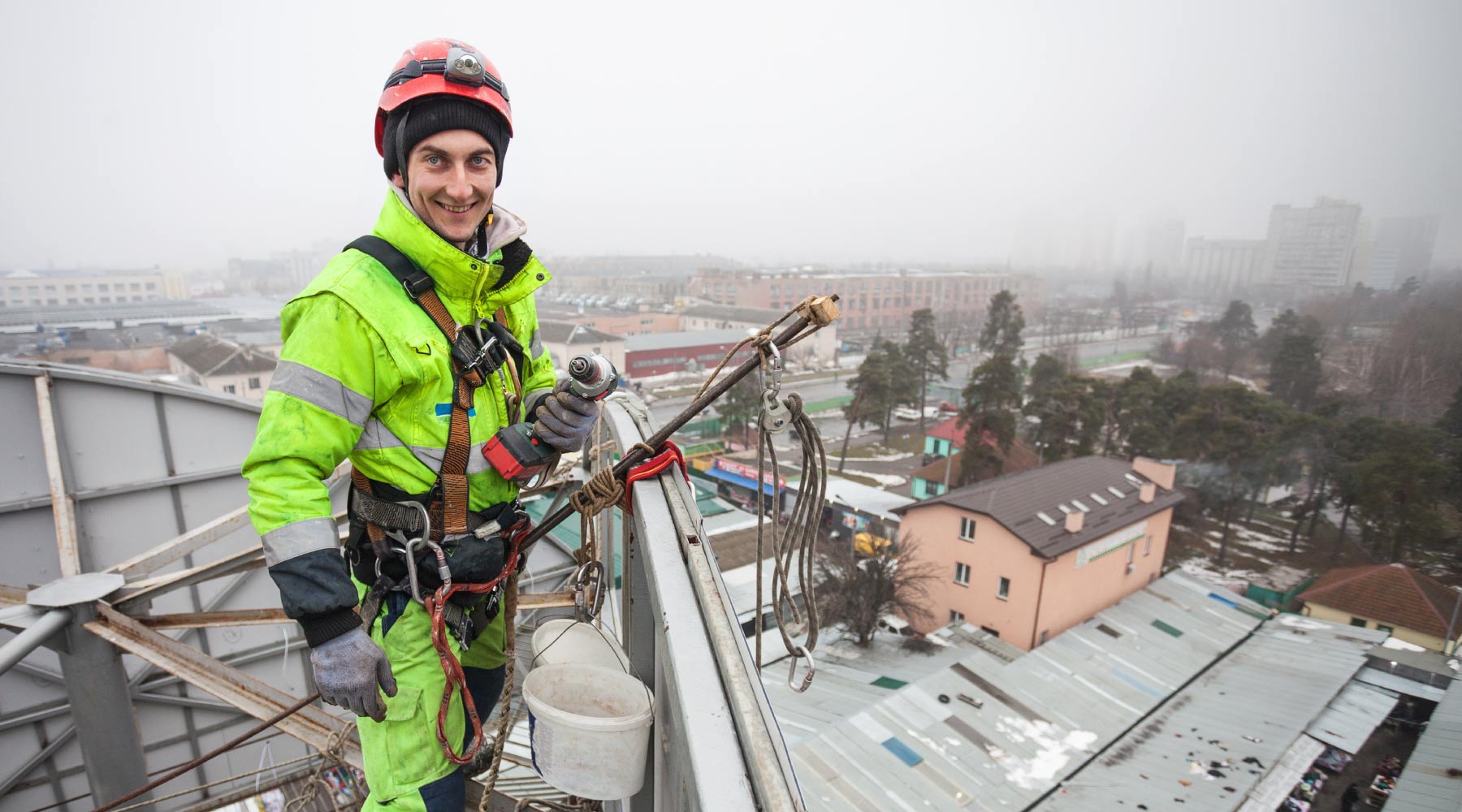 constrution workers outside in the cold use heated gear to keep warm, maintain body temperature and dexterity in fingers to perform critical tasks